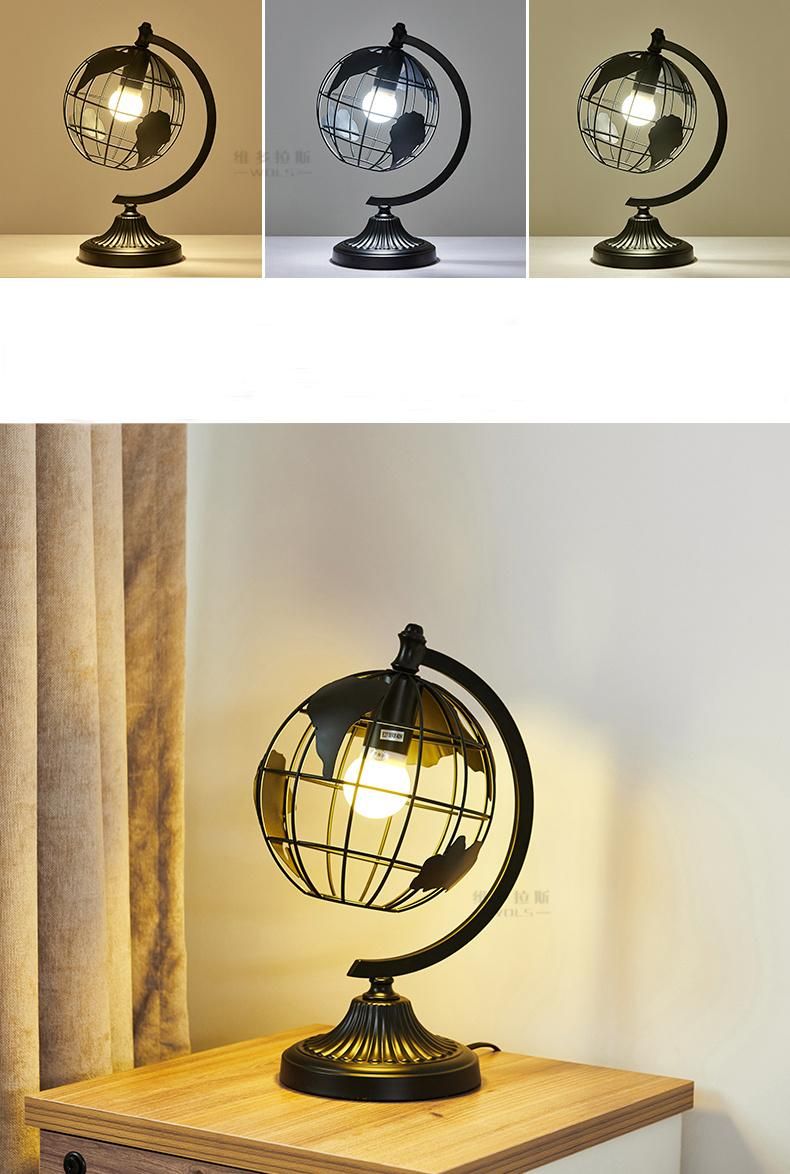 Hot Selling Black Color Iron Metal Sculpture Hollow out Rotation Decorative World Globe LED Table Lamp