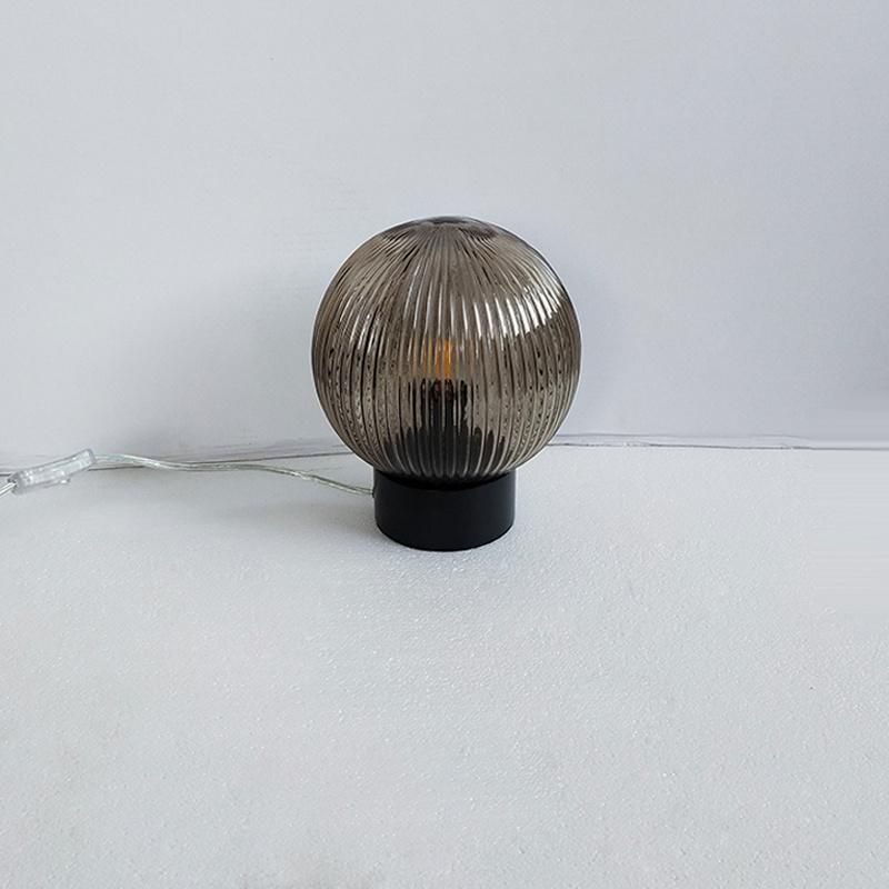 Matte Black Metal Body and Fluted Glass Ball Shade Table Lamp.