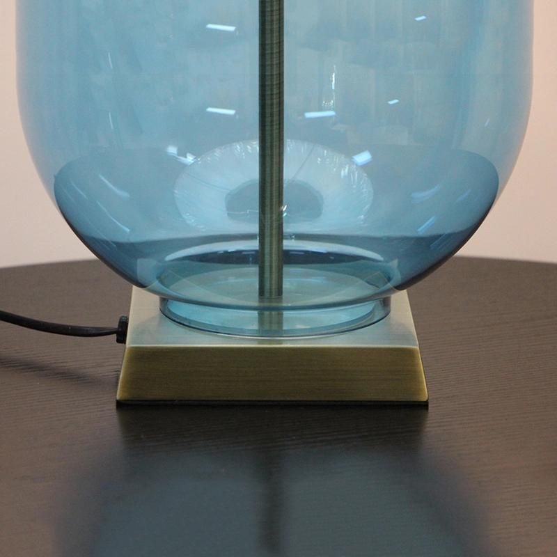 White Acrylic Fabric Lampshade and Blow Blue Glass Body Table Lamp.