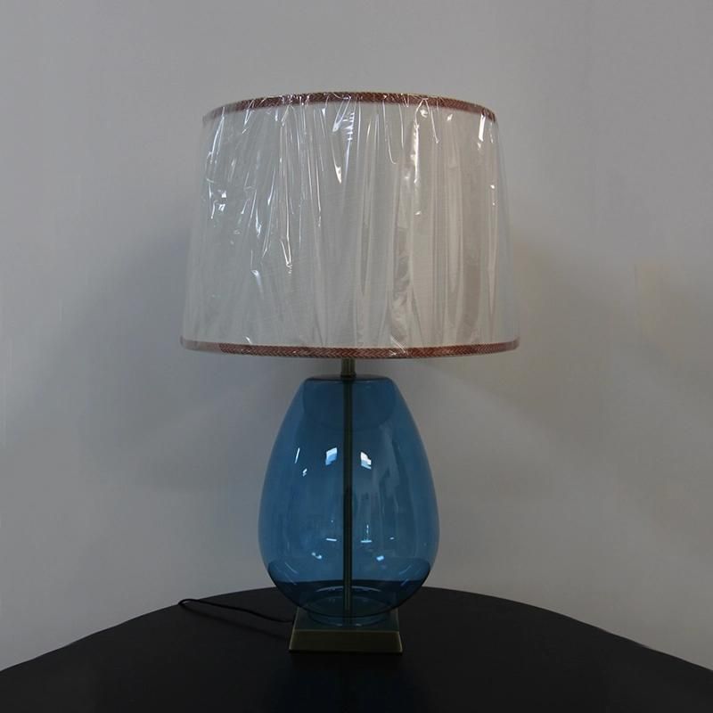 White Acrylic Fabric Lampshade and Blow Blue Glass Body Table Lamp.