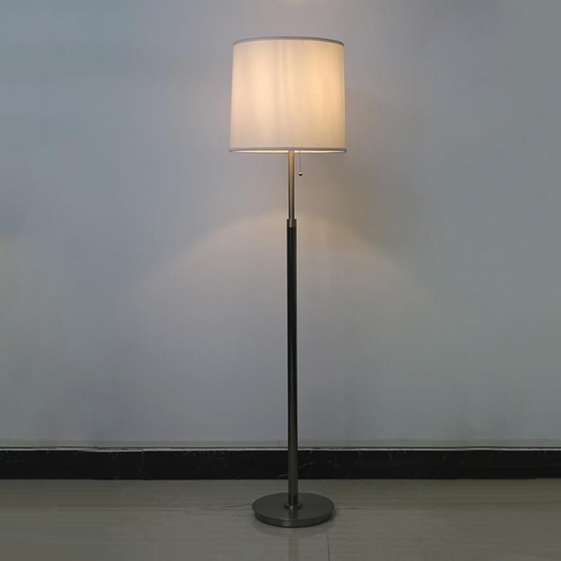 White Fabric Lamp Shade and Satin Nickel Metal Body Floor Lamp.