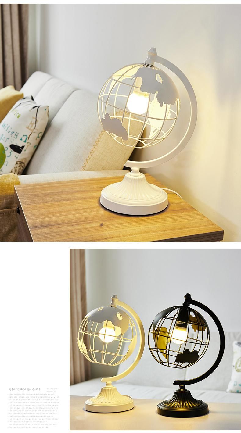 Hot Selling Black Color Iron Metal Sculpture Hollow out Rotation Decorative World Globe LED Table Lamp