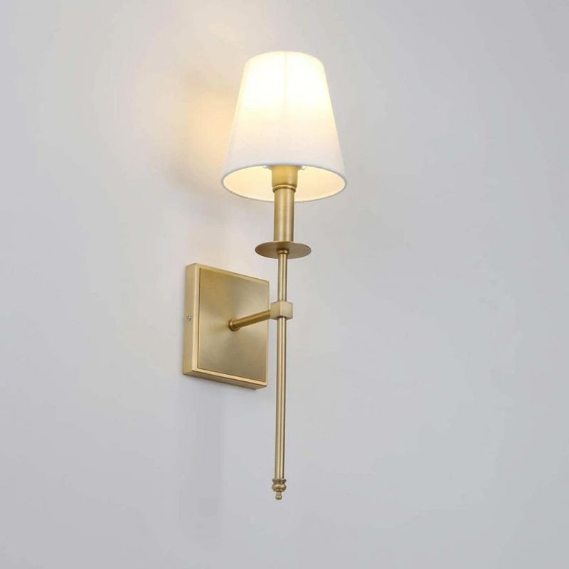 Classic Rustic Industrial Wall Sconce Lighting Fixture with Flared White Textile Lamp Shade and Antique Brass Tapered Column Stand