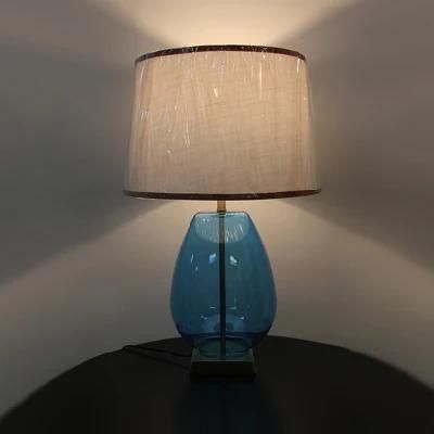 White Acrylic Fabric Lampshade and Blow Blue Glass Body Table Lamp.