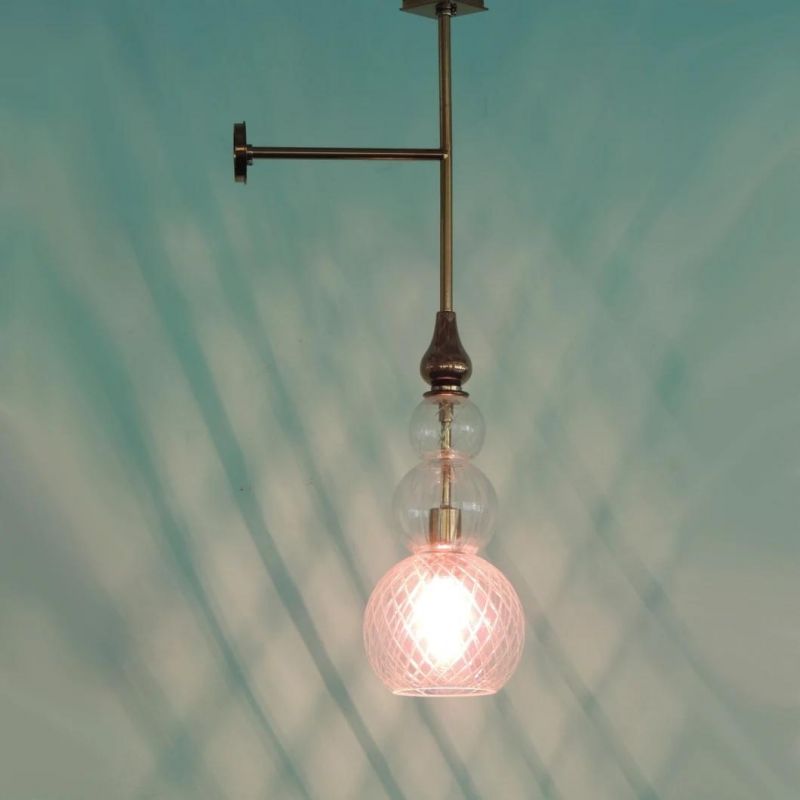 Clear Glass Lamp Shade and Golden Plating Central Rod Wall Lamp.