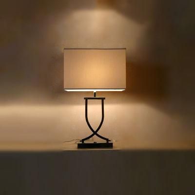 Metal Body in Chrome Finish and Beige Fabric Shade Table Lamp.
