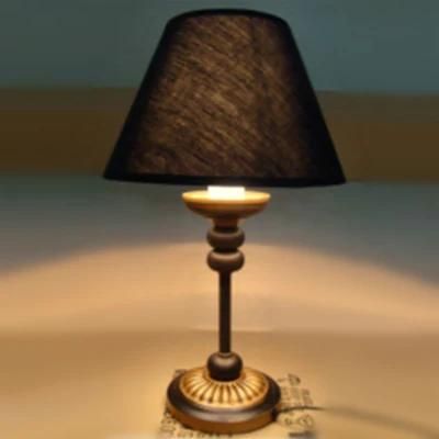 Antique Brass Painted Metal Body and Black Fabric Shade Table Lamp.