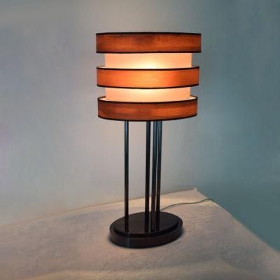 White Fabric Lamp Shade with Wood and Black Metal Lamp Body Table Lamp.